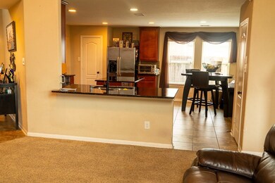 Living room view into kitchen