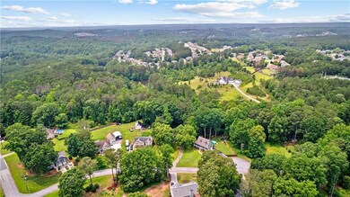Aerial overview of property's location with a forest
