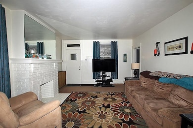 First floor living room with decorative fireplace 
