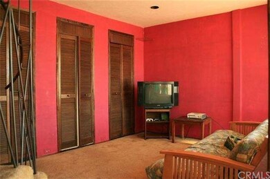 Living room with multiple closets for storage/elec