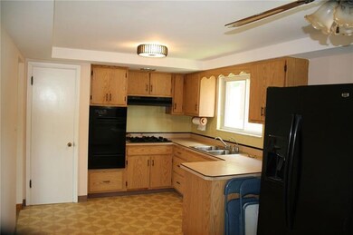 Lots of cabinets, small island ,gas cook top and d