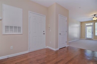 Entry-way into open-concept living room and dining