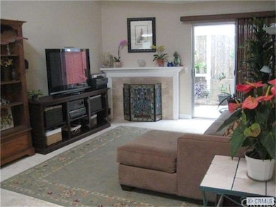 spacious living room with travertine floor and cus