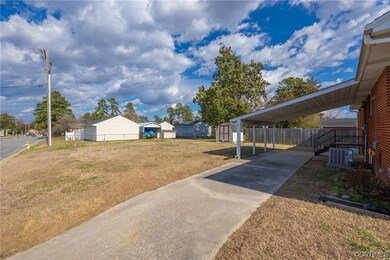 Side entry paved driveway with partial cover