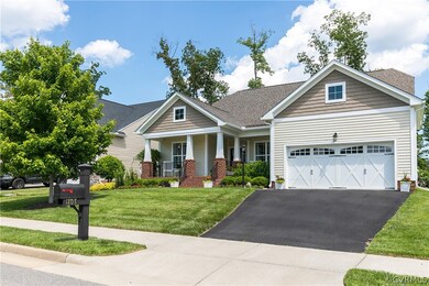 Paved driveway leads to a front-entry, 2-car garag