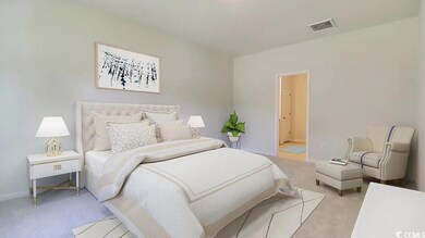 Bedroom featuring light carpet and baseboards