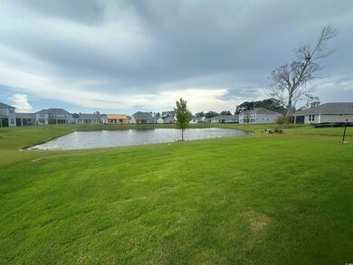 Surrounding community featuring a water view and a