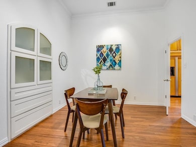 Dining area with crown molding, baseboards, visib