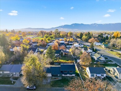 Aerial perspective of suburban area with a mountainous background