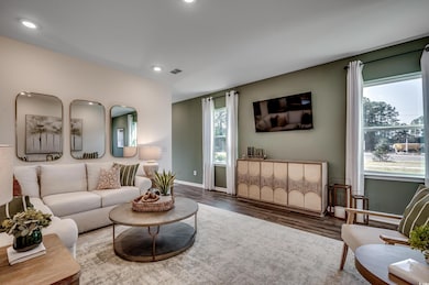 Living room with wood-type flooring