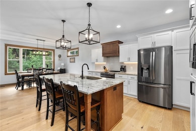 This stunning kitchen features sleek granite count