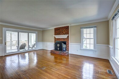 Love the handsome, raised hearth, brick FP with heavy mantle