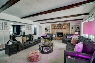 Sunken living room with fireplace.