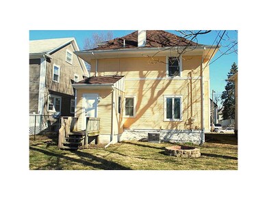 Exterior Back. with a fire pit.