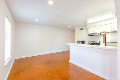 Kitchen featuring a peninsula, under cabinet rang