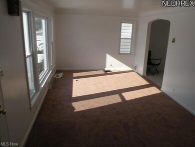 Sun filled Living Room with newer carpet.