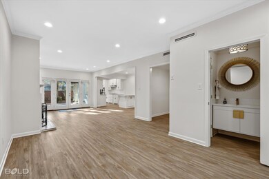 Unfurnished living room featuring sink, ornamental