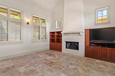 Unfurnished living room featuring a premium firep