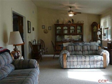 Large living room and dining area with vaulted cei
