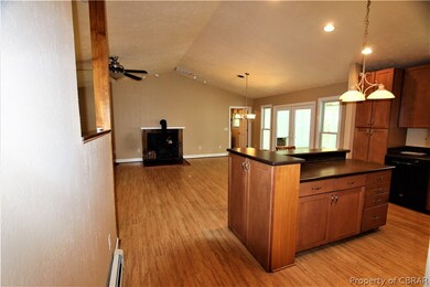 Front View of kitchen, black counter tops, open fl