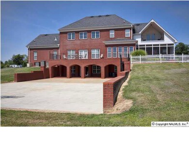 Back View of Home - Windows and doors provide an abundance of natural light.