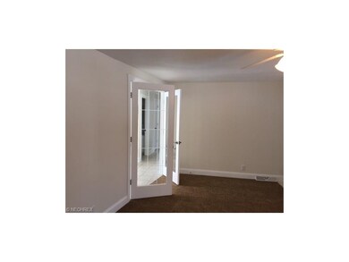 French doors lead from living room to dining room 