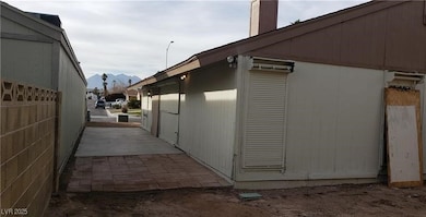 View of home's exterior featuring a mountain view and a chimney