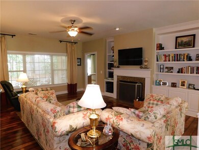 Family room overlooks covered lanai back porch.