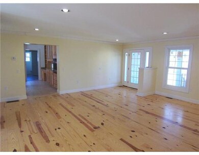 Living Room. This view shows the access from the L