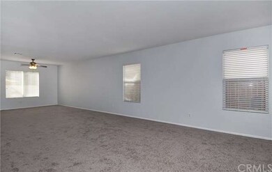 Living room opens to dining area