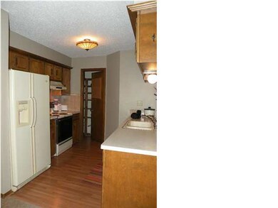Kitchen includes appliances and pantry for storage