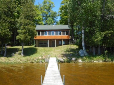 150' on S. Manistique lake with log cabi