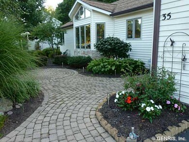 Exterior Front Winding entrance path leads to fron