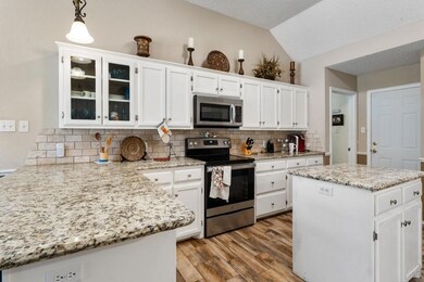Kitchen featuring tasteful backsplash, stainless s