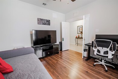 Bedroom with hardwood / wood-style floors