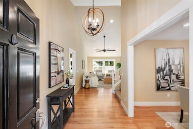 Step into a welcoming foyer with hardwood floors and sightlines that flow into the heart of the home.