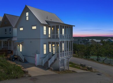 View of front of home with metal roof, a standing 