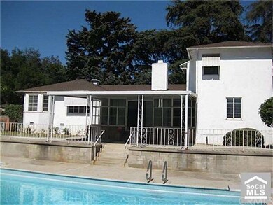 Covered patio from far side of pool