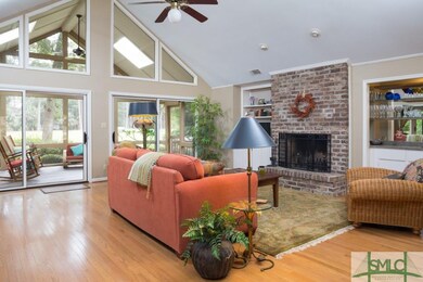 Cozy seating area centered on the brick fireplace 