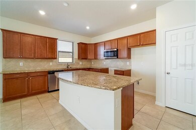 The tiled kitchen features all stainless steel app