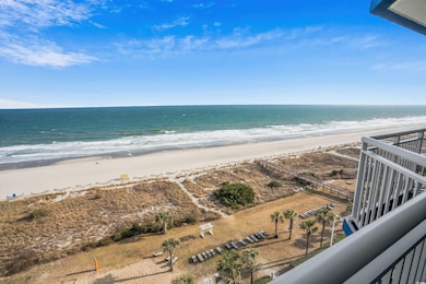 Property view of water with a beach view
