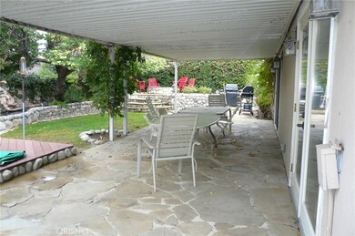 Rear yard,covered patio, raised fire pit.