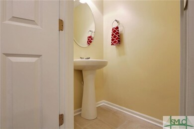 Half bath on lower level has upgraded light fixtur