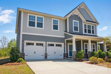 Lots of parking with an oversized driveway and a two-car garage.