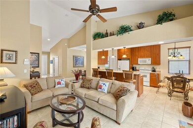 Living area with recessed lighting, a ceiling fan,