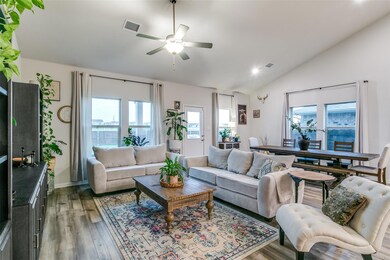 Living room with ceiling fan, hardwood / wood-styl
