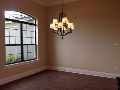 FORMAL DINING ROOM with wood tile flooring - BLINDS COMING!