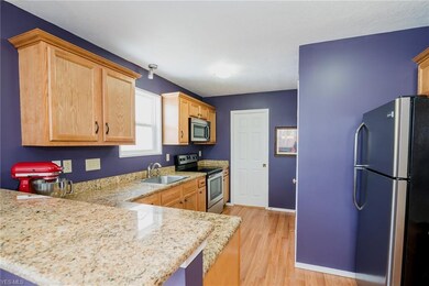 Wood laminate flooring in the kitchen and eating a