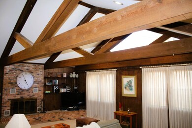 Wood beamed cathedral ceiling in Family Room