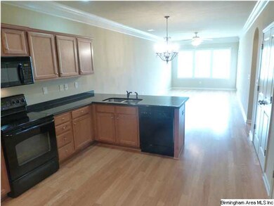 GRANITE COUNTER TOPS AND WOOD FLOORS.